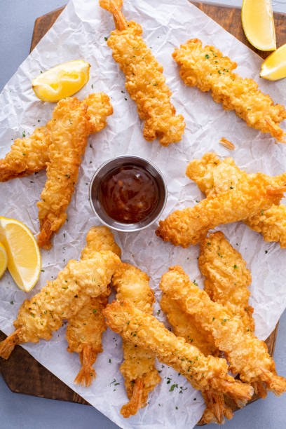 istock Cooked tempura shrimp on a serving board with dipping sauce 1978764566