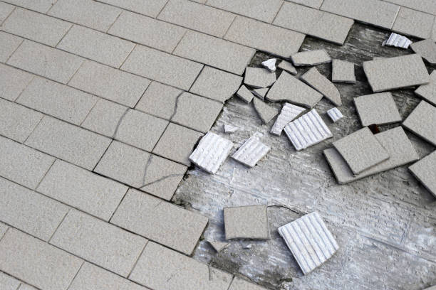 istock Cracked brown tiles on cement floor 1978774478