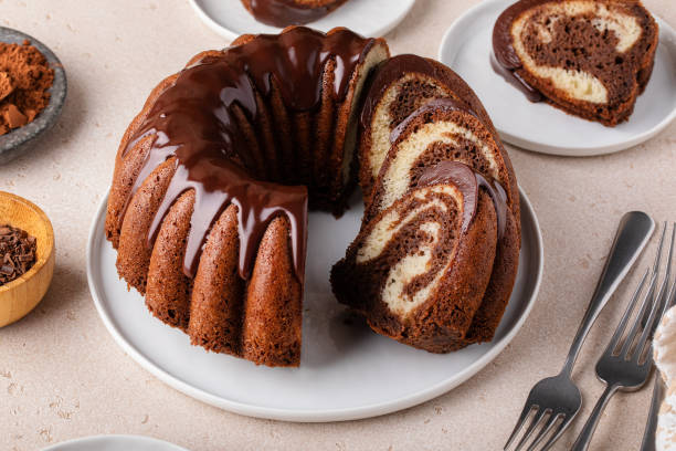 istock Marbled bundt cake sliced on a plate, chocolate and vanilla marble cake with chocolate glaze 1978780766
