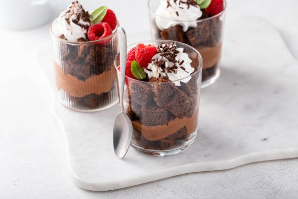istock Chocolate mousse and brownie parfait layered in a cup with raspberries 1978781283