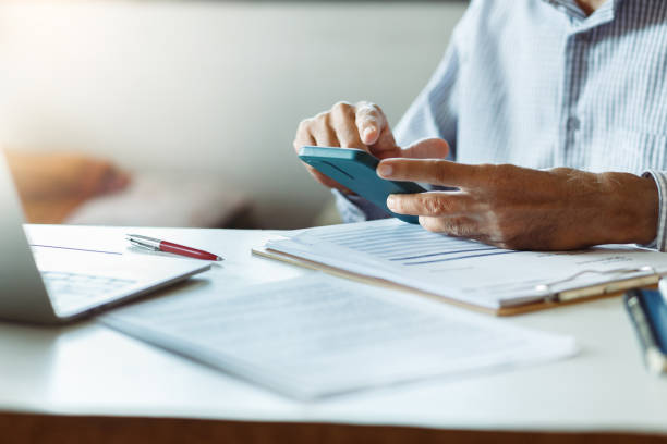 istock businessman work with laptop and mobile 1978826995