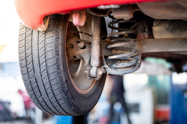 istock Rusty shock absorber coil spring of old red car 1978831857