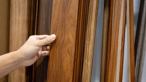 istock Hand picking sample of wood plank material in home design store 1978837352