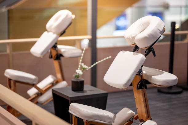 istock Portable adjustable massage chair in a cozy spa 1978837394
