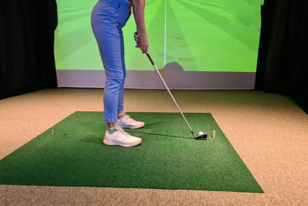 istock Golfer Swinging Club on Simulator Screen in Modern Sport Club Setting 1978841748