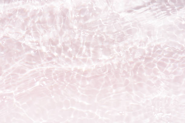 istock White water with ripples on the surface. Defocus blurred transparent white colored clear calm water surface texture with splashes and bubbles. Water waves with shining pattern texture background. 1978878972