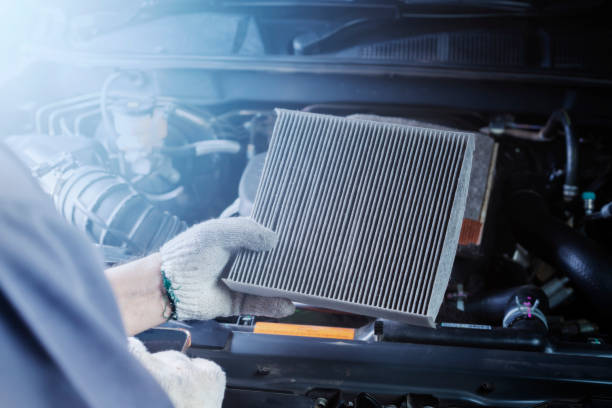istock Car air conditioner system maintenance, Hand mechanic holding car air filter to check for clean dirty or fix repair heat have a problem or replace new or change filter. 1978923636