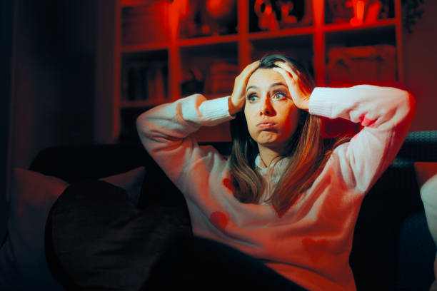 istock Stressed Woman Sitting Along on the Couch 1978923705