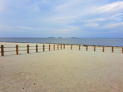 Jakarta, Indonesia - January 30th 2024 : Pantai Indah Kapuk Aloha atmosphere with white sand, sea and blue sky very beautiful