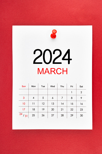 March 2024 calendar page with push pin on red background.