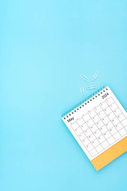 istock Desk calendar for May 2024 and white paper clip on a light blue background 1978929036