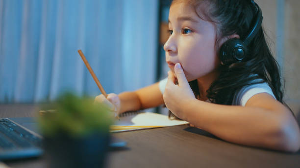 istock Girl doing homework at home 1978989508