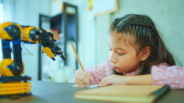 istock Little Girl Building Robotic Arm At School 1978989510