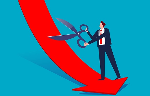Loss mitigation, business forecasting or risk avoidance, avoiding a business crisis, businessman holding scissors to cut falling arrows