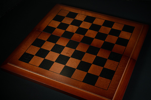 Chess or checkerboard  isolated on black background.