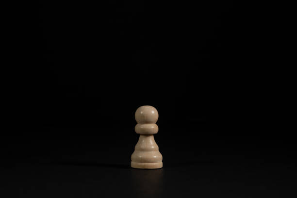 Isolated image of white pawn chess piece on black background.