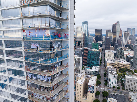 February 1, 2024 - Los Angeles, CA: A group of buildings known as the Oceanwide Plaza have sat unfinished for years due to supposed financing issues with the developer. Recently, people have been breaking into the buildings and writing graffiti on the walls.