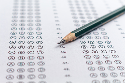 Photograph of an answer sheet for an entrance exam with a pencil.