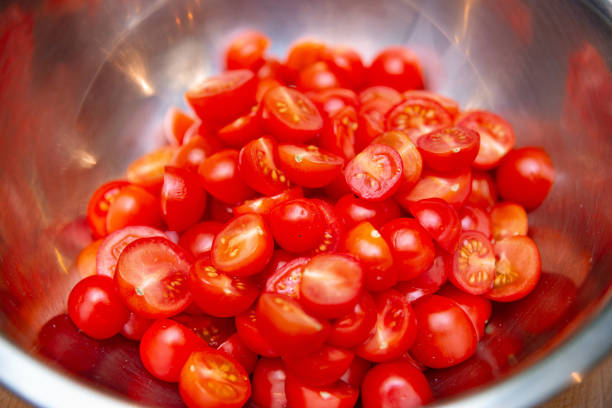 istock Sliced Cherry Tomatoes in Stainless Steel Bowl 1979130055
