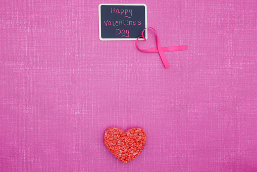 Happy Valentines Day chalk board with heart ribbon and rice cookie with copy space