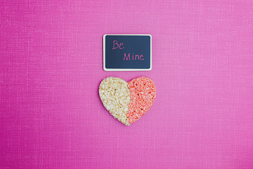 Be Mine chalk message with pink and white rice treat heart.  Valentines Day, Love, Date Night, Proposal, Anniversary, Romantic.