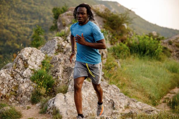 istock Young African man jogging in nature on sunny day 1979245051