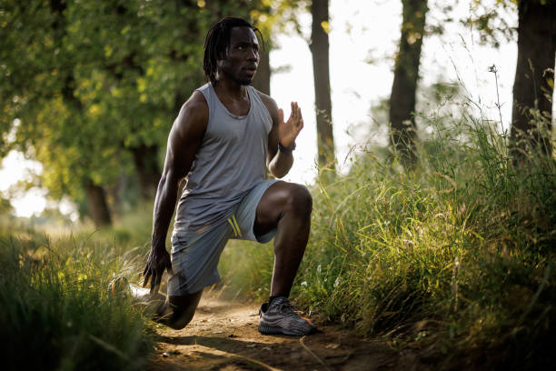 istock Young African man exercising in nature on sunny day 1979247103