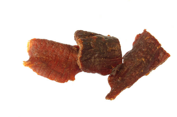 close up on beef jerky isolated on white background