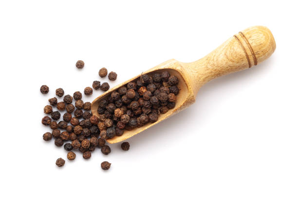 istock Organic Black pepper (Piper nigrum) in a wooden scoop. 1979319116