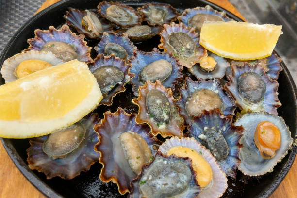 istock A plate with delicious fresh mussels and lemon wedges. 1979349982