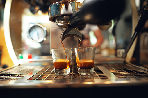 espresso shot pouring out of machine