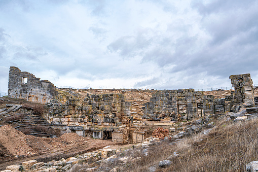 The buildings of a gymnasium and bath are among the most impressive in Termessos. Much is overgrown, but the front has been cleared and is architecturally interesting. Antalya, Turkey.