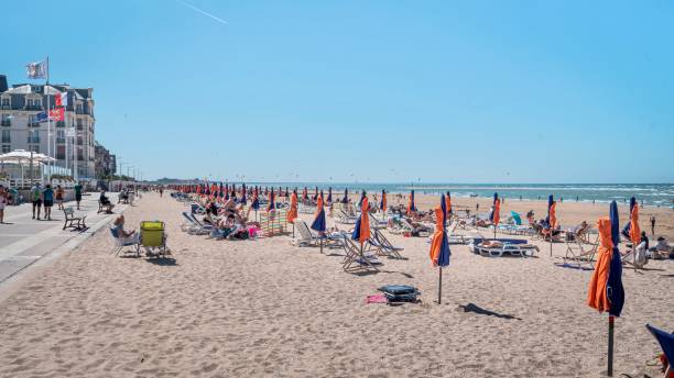 istock Colorful beach umbrellas and chairs adorn a scenic oceanfront beach 1979432086