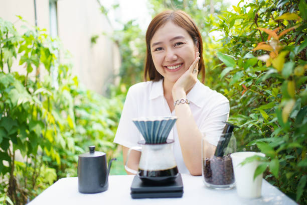 istock Woman making and drinking a craft coffee. 1979434849