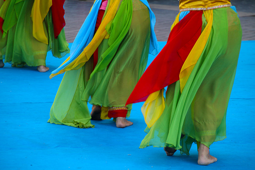 The Indonesian folk dancers performing at an outdoor festival