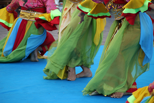 The Indonesian folk dancers performing at an outdoor festival