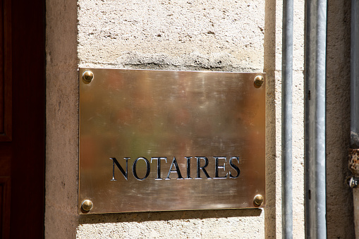 notaires france text golden signage brand of notary office french logo sign on wall facade entrance