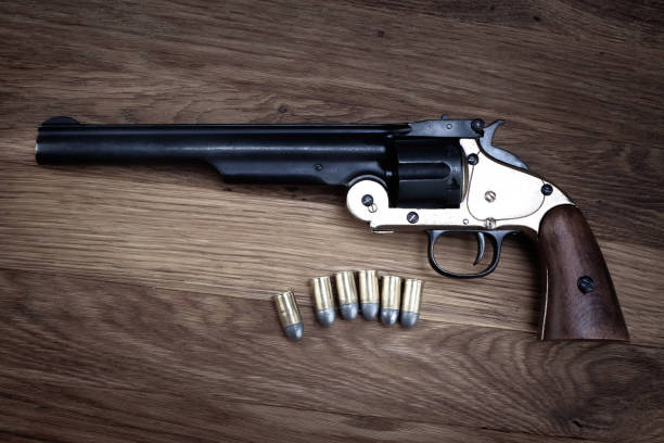 istock Old West .44 caliber single action revolver gun with rounds 1979460250