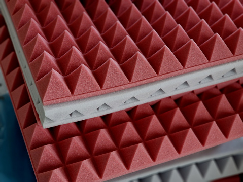 anti noise materials for door fillings and recording studios. foam with an articulated pyramid pattern. padding shattering sound waves in the apartment, acoustic