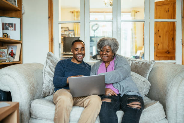 istock Mature middle class couple using laptop at home 1979480817