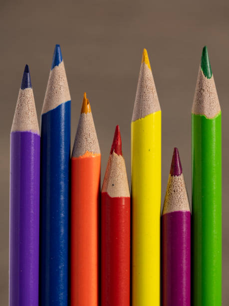 Colorful pencils arranged on a sleek surface.