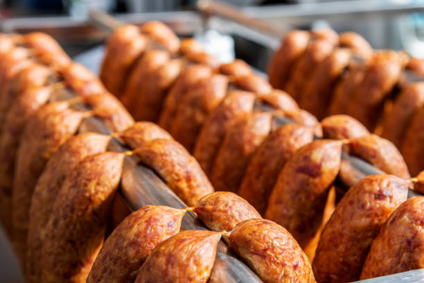 Homemade sausages hanging in a row