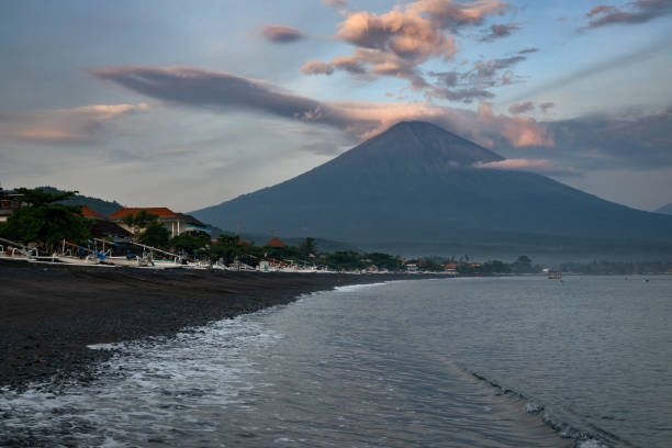 istock Black sand beach and mount Agung at sunset in Amed, Bali 1979504015