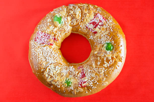 istock Ring shaped cake. Roscon de reyes. Red background. Spain 1979510973