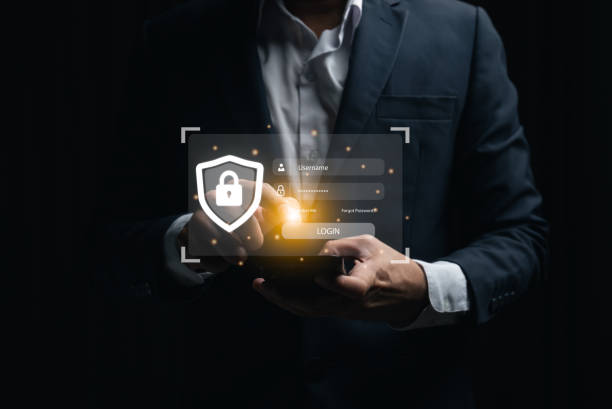 istock Businessman using mobile phone and laptop login to access, information security and encryption, secure access user's information, Internet access, cybersecurity. Cyber security technology concept. 1979514139