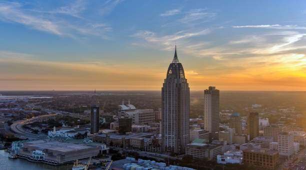 istock Downtown Mobile, Alabama riverside skyline at sunset 1979523483