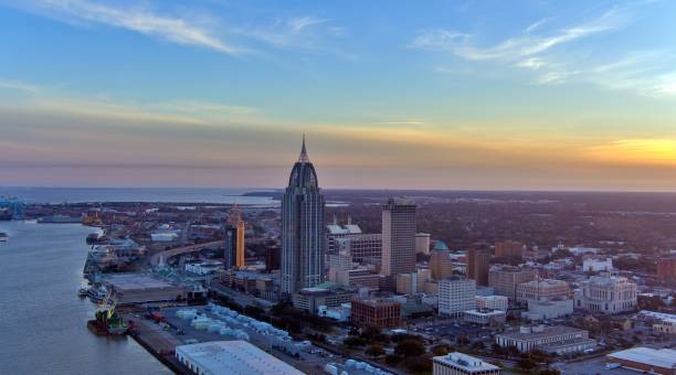 istock Downtown Mobile, Alabama riverside skyline at sunset 1979523996