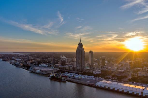 istock Downtown Mobile, Alabama riverside skyline at sunset 1979523998