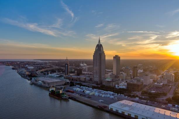istock Downtown Mobile, Alabama riverside skyline at sunset 1979524030
