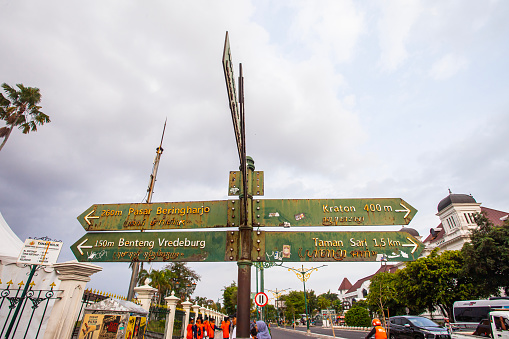 Directional signs at the zero kilometer point in Jogjakarta showing tourist attractions in Jogjakarta. The zero kilometer point is one of the favorite destinations in Jogjakarta, Indonesia.